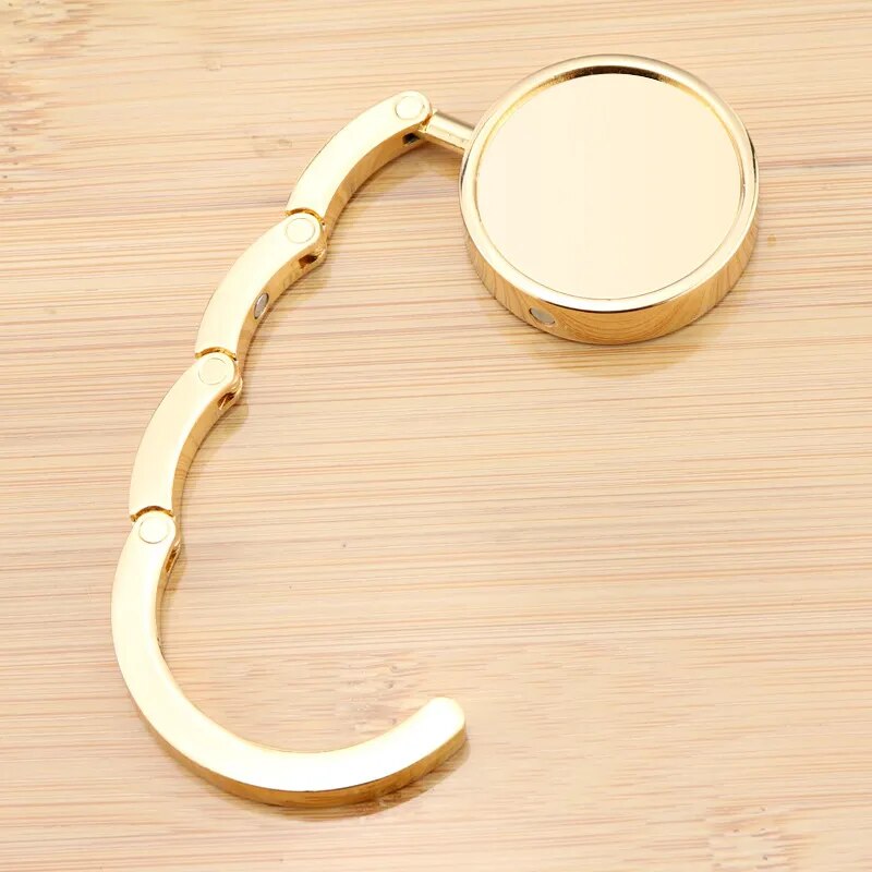 Accroche sac à main doré chic